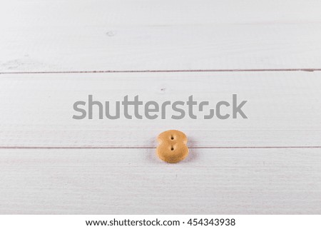 cookie font numbers on white planks.