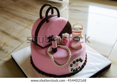 Exclusive cupcake. It is made in the form of a women's handbag with sandals. Order for birthday parties for the child. Original decoration.