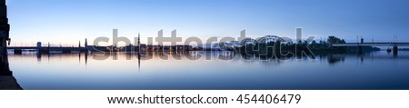 View on Riga cityline panorama in early morning over river Daugava. Panoramic montage from 11 images. Royalty-Free Stock Photo #454406479
