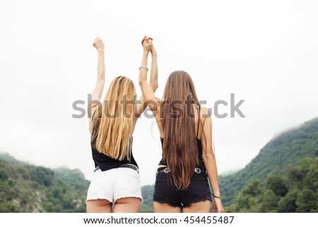 Back of two girls together in nature