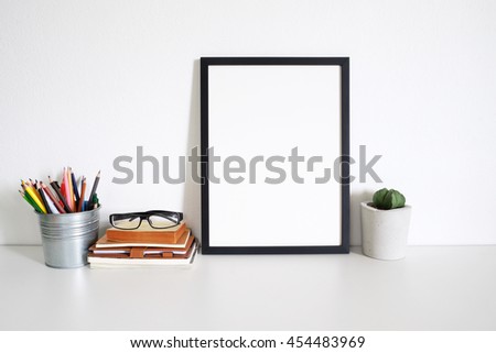 mock up blank photo frame on table.home office decor
