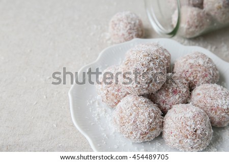 Homemade strawberry, date, cashew and coconut bliss ball, keto, ketogenic, low carb diet, sugar free, dairy free and  gluten free dessert Royalty-Free Stock Photo #454489705