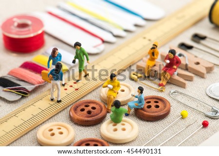 sewing tools and miniature women