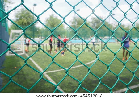 Wire mesh fence from football field with competitive in the public areas in the Thailand country.