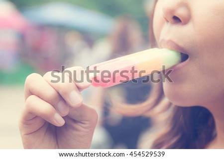 close up asian woman  eating  ice cream , in vintage style