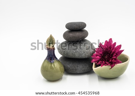Hot stone,Ceramics with flower in white background.