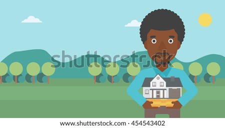 An african-american man holding house model in hands on the background of mountains. Real estate agent with house model. Vector flat design illustration. Horizontal layout.