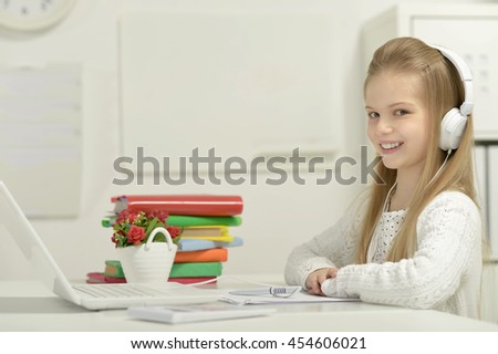 Cute little girl  and  laptop