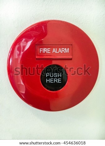 Circular fire alarm button which connects the fire alarm system for detecting and warning people through visual & audio appliances for smoke, fire, or emergencies. It can be a metaphor for warning.
