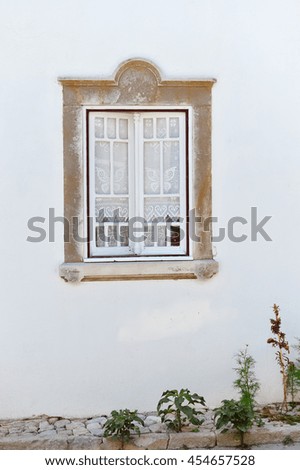 Closeup view of window with beautiful decorative protective lattice