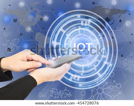 Man is using mobile telephone to run he worldwide business overlay with digital layer, internet of thing concept.