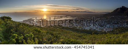 A series of pictures capturing a winter's sunrise over Cape Town, South Africa. Taken from Signal Hill overlooking the city and Table Mountain National Park.
