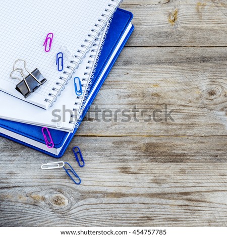 Stack of notebooks on wooden table