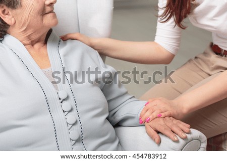 Cropped picture of a senior woman smiling to her daughter