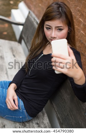 Selfie time. Joyful young women making selfie by her smart phone