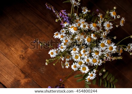 daisies bouquet,  of flowers on the old wooden background