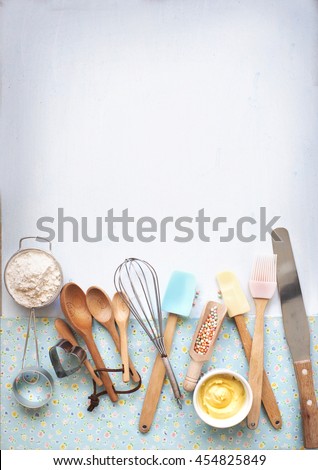 Baking utensils and ingredients on pastel light blue background. Flat lay bakery text space images. Royalty-Free Stock Photo #454825849