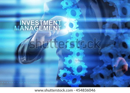 Businessman is selecting Investment management on the virtual screen.