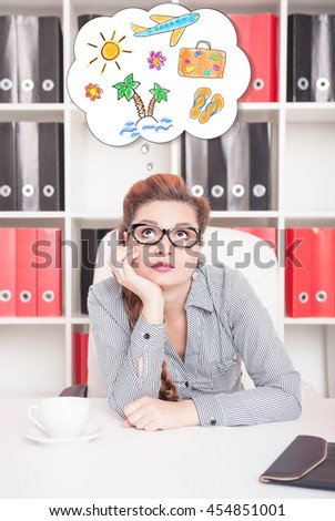 Bored business woman dreaming about holiday in office. Overwork concept