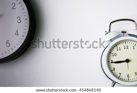 Two clocks isolated on white background