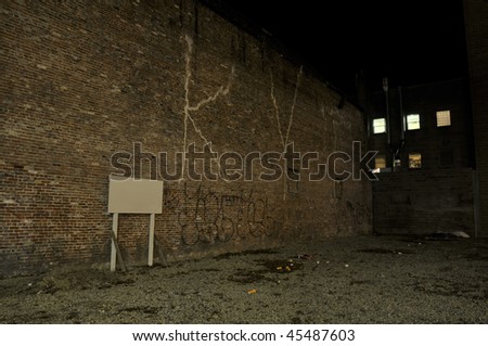 brick wall and sign at night