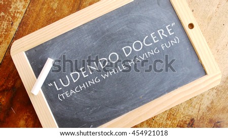 Ludendo docere. Latin phrase, usually translated into English as "teaching while having fun".