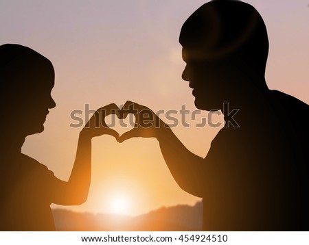 Silhouette Of A Girl Holding In Hand Silhouette Of A Man With A Marriage Proposal Stock Photos And Images Avopix Com