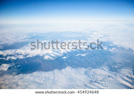 Skyline View above the Clouds from air on mountains