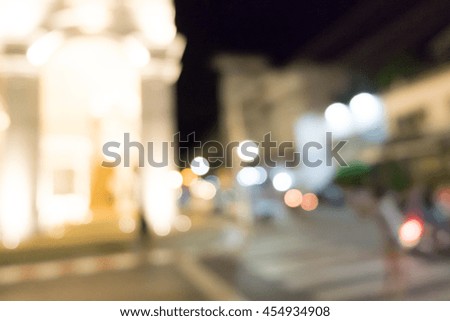 Night city lights blur.