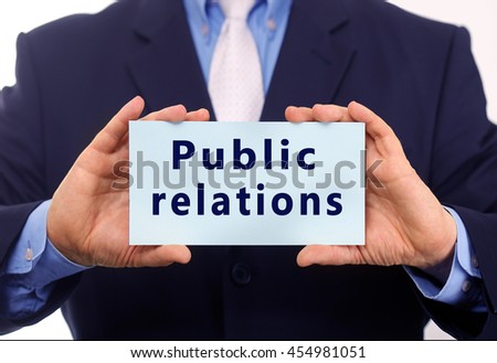 Business man hold paper public relations text on it