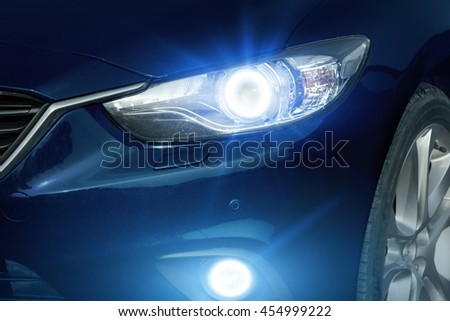 Angel eyes xenon headlight glowing optics lens Royalty-Free Stock Photo #454999222