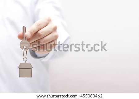 House key in hand  Royalty-Free Stock Photo #455080462