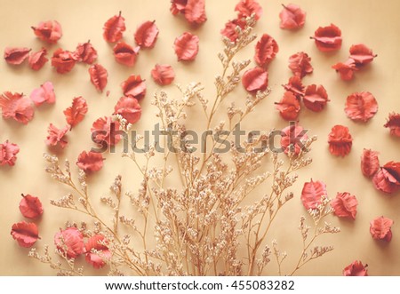 Dried flowers soft focus and out in a frame shape with free space in vintage tone background.
