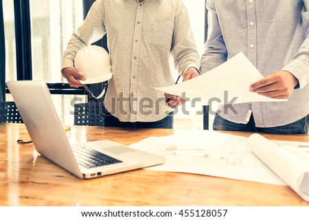 engineer people meeting working in office for discussing, engineering concept, architecture concept, soft focus, vintage tone Royalty-Free Stock Photo #455128057