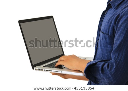 Young man working with laptop, man's hands on notebook computer, business person at workplace.Clipping path included.