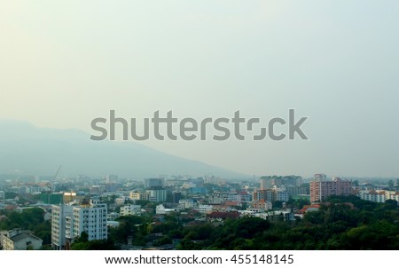 city and mountain in the mist