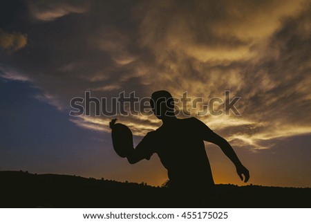 silhouette of a man at sundown