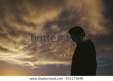 silhouette of a man at sundown