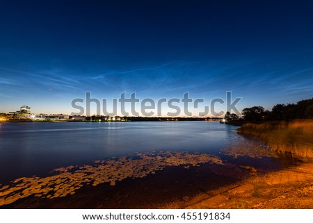 Beautiful sky phenomenon noctilucent clouds over beach in Latvia