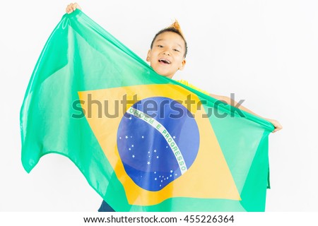 Brazilian patriot boy holding Brazil flag. Football or soccer championship. Support fan. White background