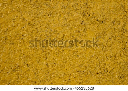 abstract background - embossed dark yellow painted wall