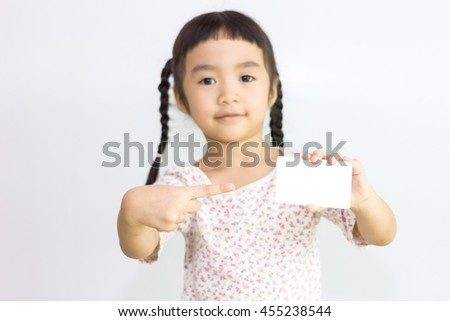 Asian girl holding white card.(Focus her hand)