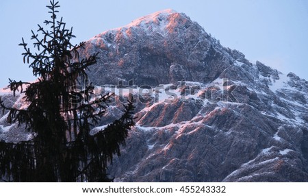 winter scenery of snowy mountains in julian alps in sunset, slovenia
