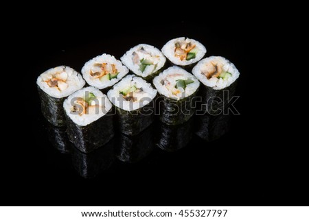 Traditional japanese rolls isolated on a black background