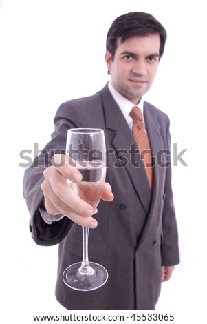 A glass of champagne held by a businessman isolated over white background