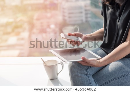 Digital easy lifestyle blog writer or business person work at home using smart device working on internet communication technology, reading e-book, paying online banking e-commerce payment Royalty-Free Stock Photo #455364082
