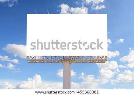 Blank billboard with blue sky and clouds for advertisement. 