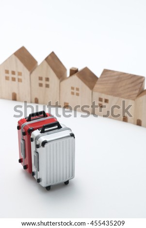 Houses and suitcases on white background.
Vacation rentals, renting private homes and rooms.
