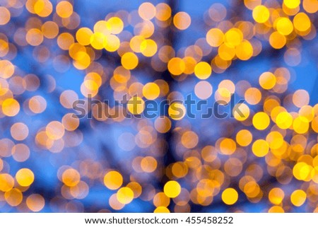 Festive gold background with out of focus light dots
