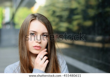 Closeup portrait of beautiful girl in town, very shallow depth of field